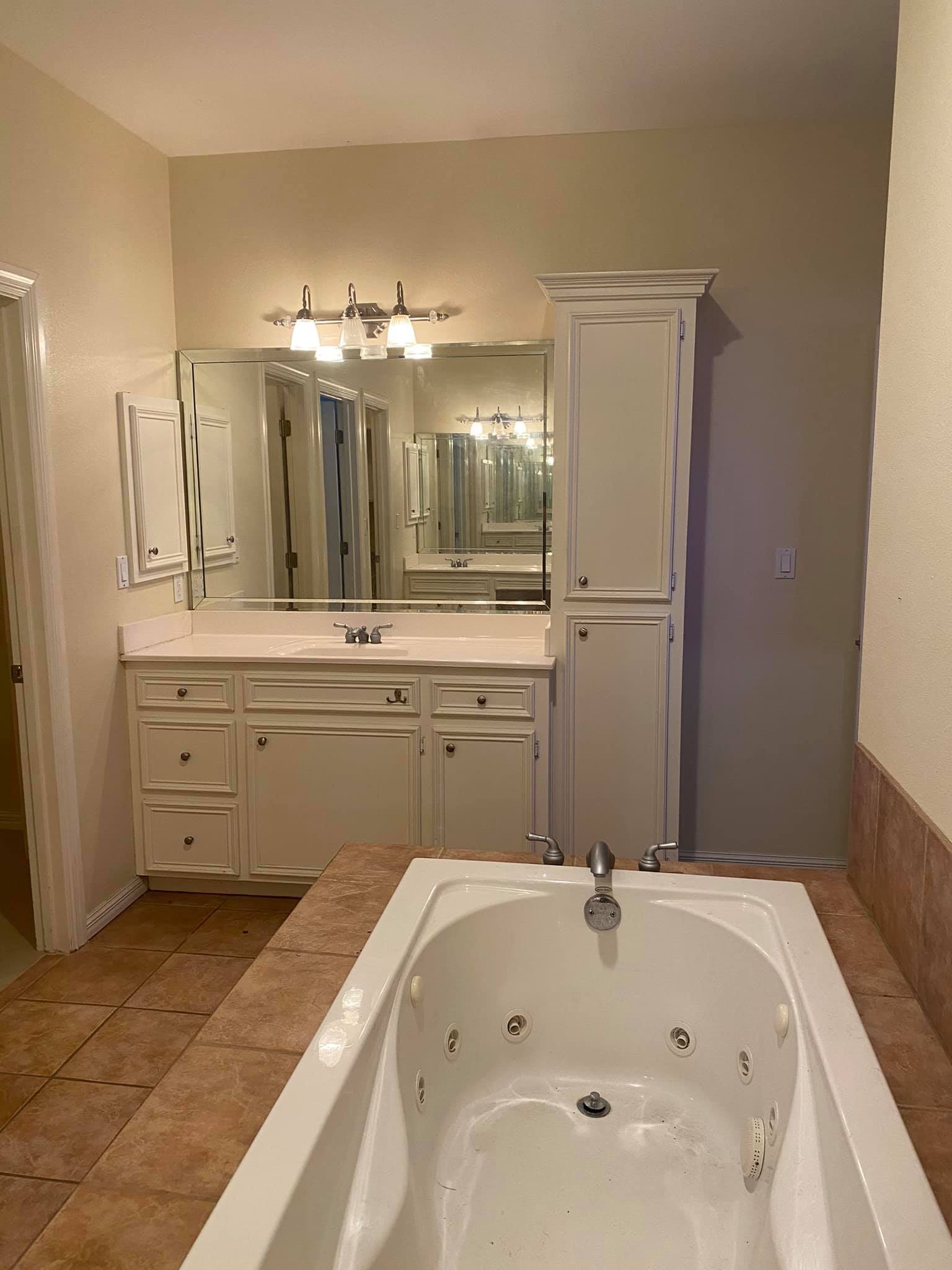 Master Bath — Dark Marble & Vessel Sinks