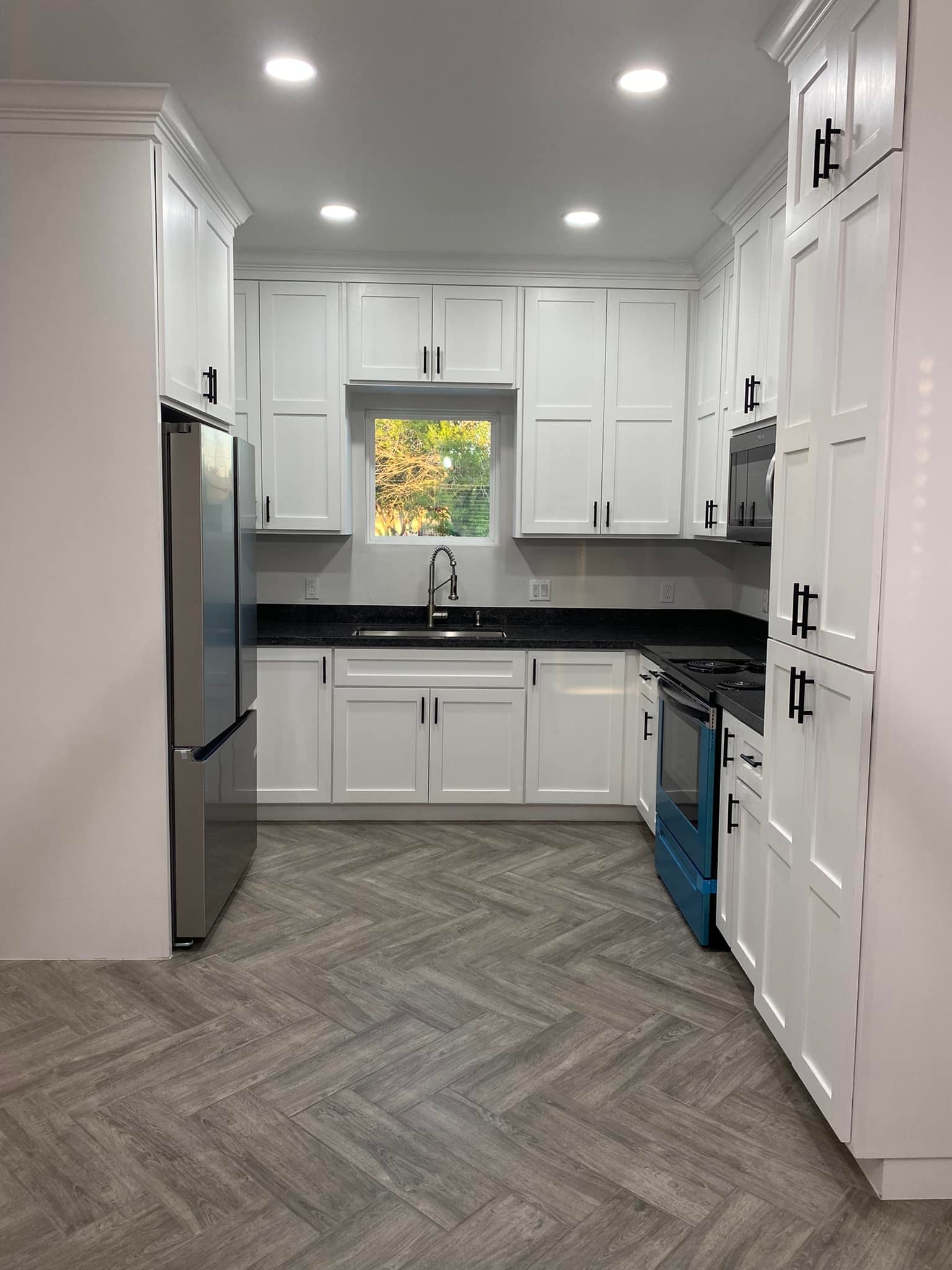 Kitchen Remodel — White Shaker & Herringbone Floor